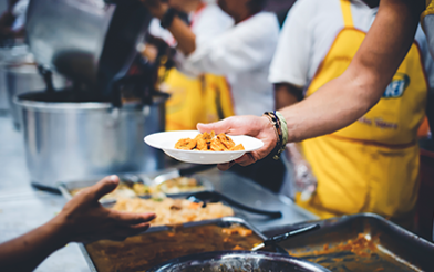 serving food on plate in a line