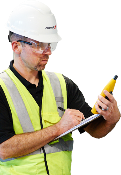 facility worker taking notes on a clipboard