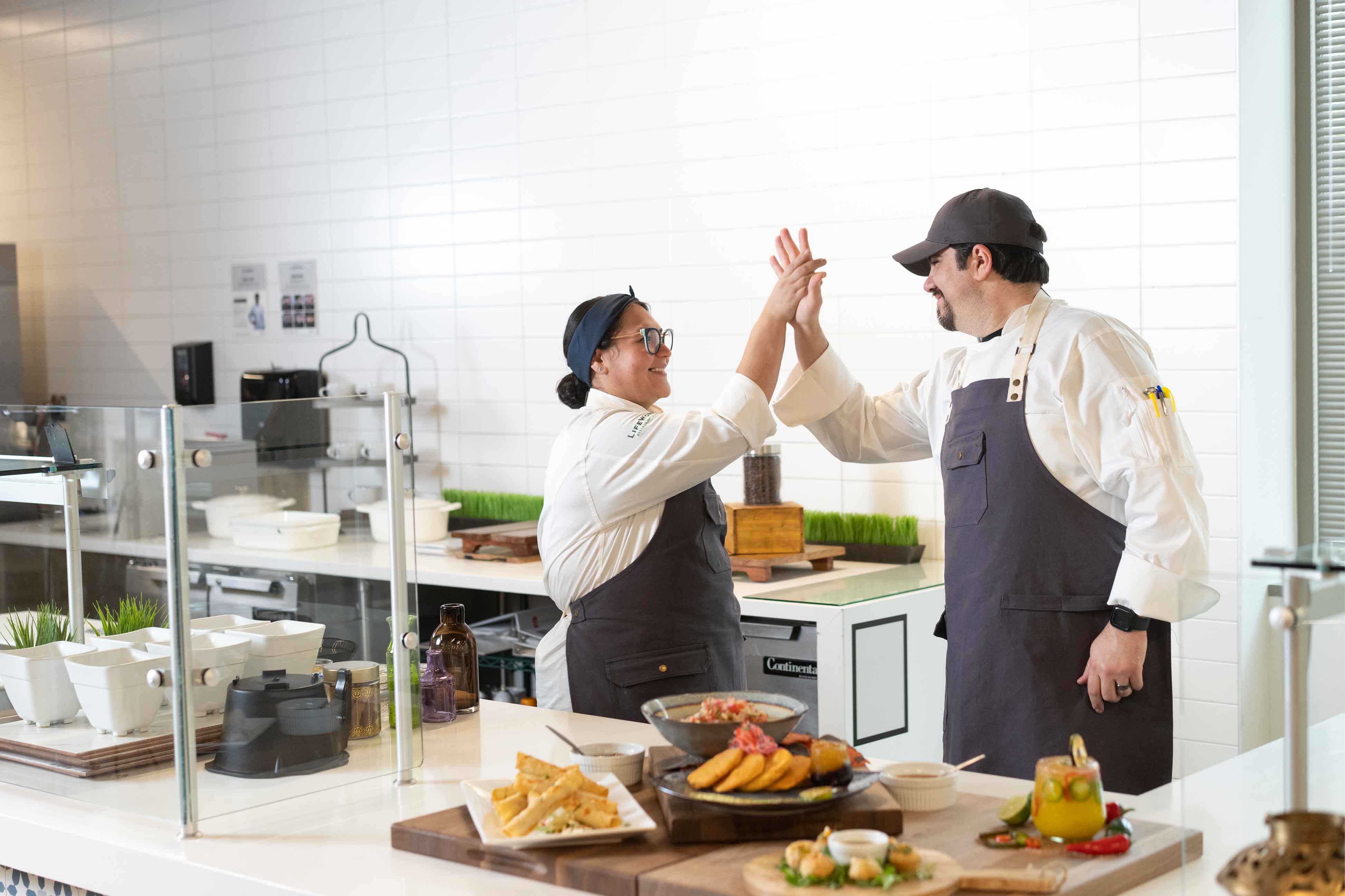 chefs giving each other a high-five