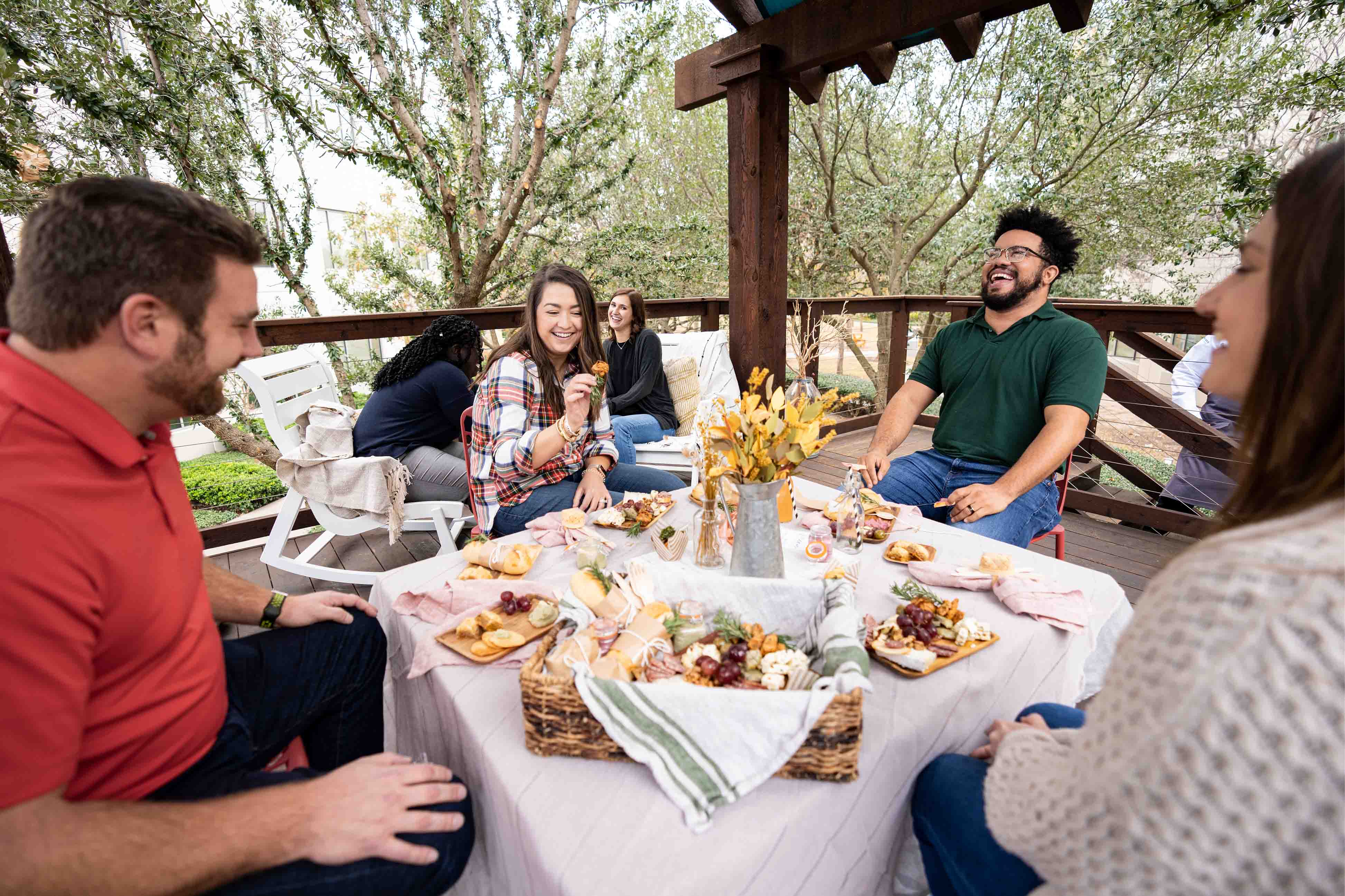 people sitting around a table laughing