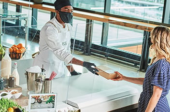 chef handing person food